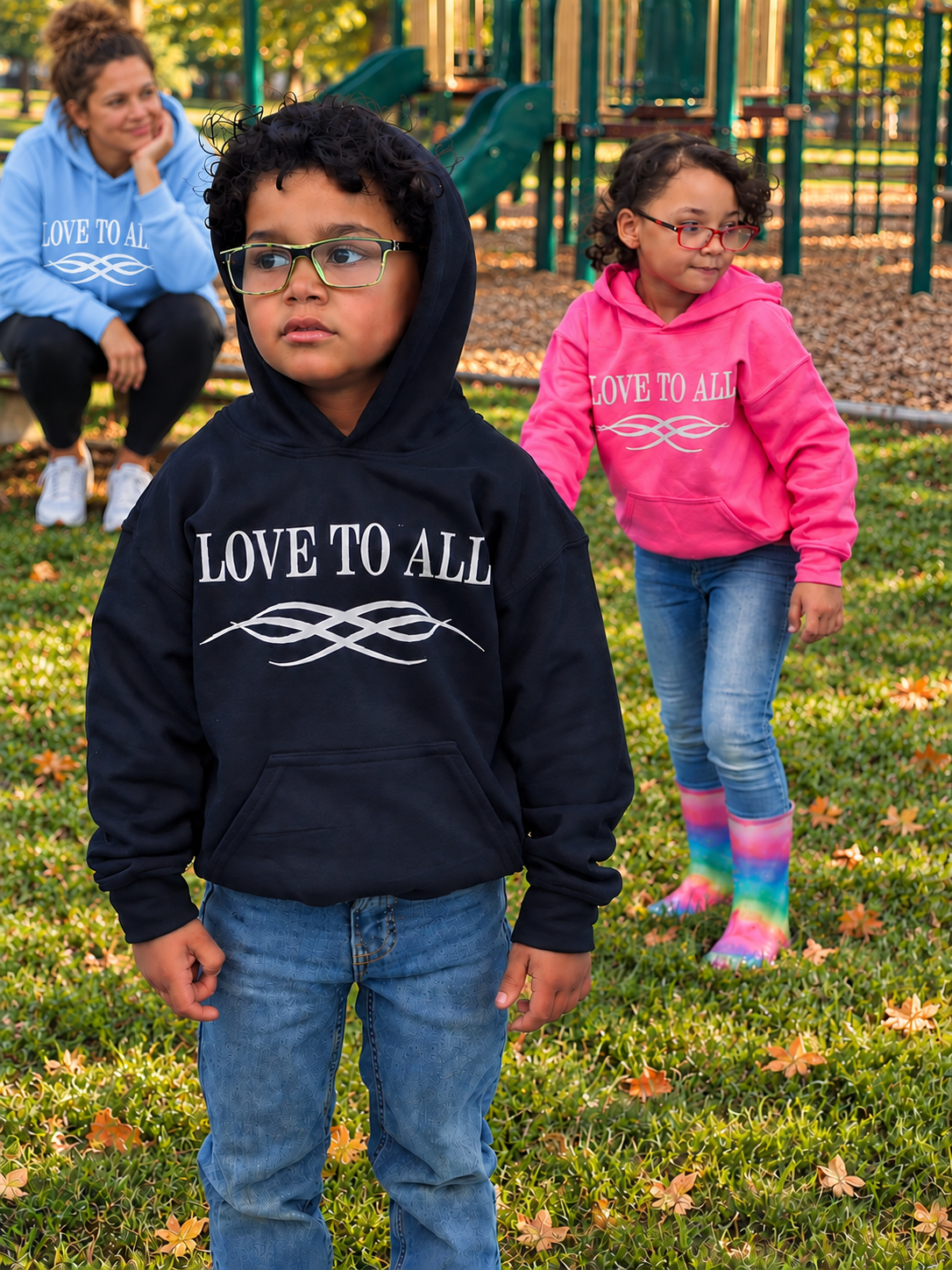 Children wearing LOVE TO ALL hoodies at a neighborhood playground